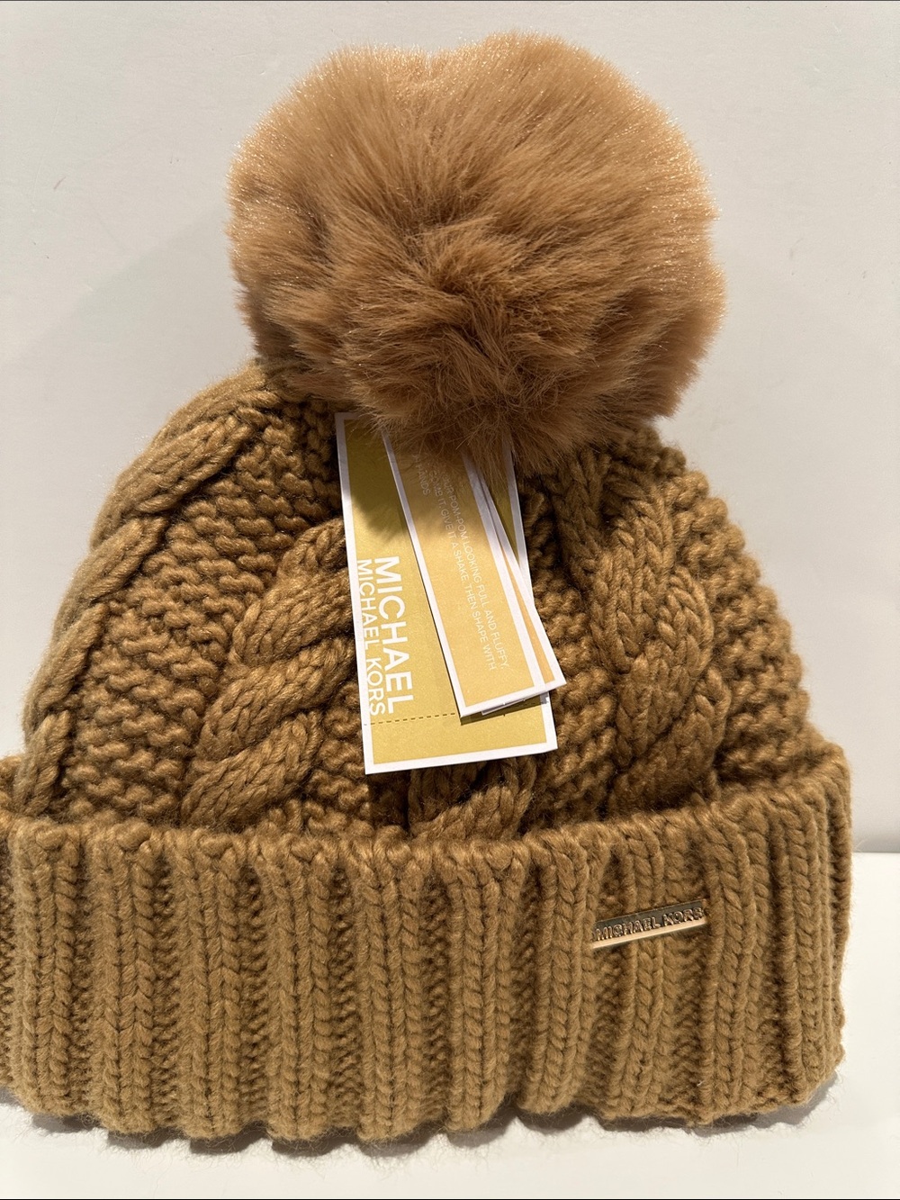 NWT Michael Michael Kors Mustard Colored Filly Lined Beanie with Pompom.